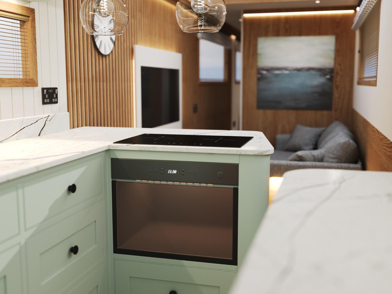 Oakums Bowless galley with painted cabinetry and marble effect worktops